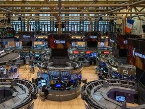 Traders work on the floor of the New York Stock Exchange during morning trading on May 17, 2024 in New York City.