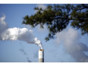 Emissions rise from the coal-fired Santee Cooper Cross Generating Station power plant in Pineville, South Carolina, U.S., on Thursday, March 22, 2018. Photographer: Luke Sharrett/Bloomberg