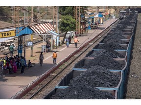 Freight wagons laden with coal sit at the Tori station on the Tori-Shivpur rail line, operated by Indian Railways and funded by Coal India Ltd., in Chandwa, Jharkhand, India, on Thursday, May 17, 2018. State miner Coal India's output and shipments jumped to seasonal records in June, buoyed by summer demand from power stations, the company's biggest customers.