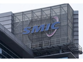 A logo atop the Semiconductor Manufacturing International Corp. (SMIC) headquarters in Shanghai, China, on Tuesday, March 23, 2021. SMIC will build a $2.35 billion plant with funding from the government of Shenzhen, the first major project to emerge from China's masterplan to match the U.S. in advanced chipmaking. Photographer: Qilai Shen/Bloomberg