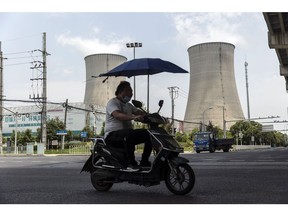 Cooling towers of a thermal power plant in Shanghai, China, on Wednesday, July 27, 2022. The searing heat that has gripped China for over a month has boosted power generation to a record high in southern regions, leading to outages in some places as demand for air-conditioning strains the network. Photographer: Qilai Shen/Bloomberg