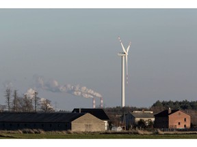 A wind turbine near the Belchatow coal powered power plant in Rusiec, Poland. Photographer: Bartek Sadowski/Bloomberg