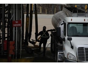 A worker refuels a gasoline tanker truck at the Valero Energy Corp. oil refinery terminal in Memphis, Tennessee, U.S., on Wednesday, Feb. 16, 2022. The U.S. and other major oil-consuming nations are considering releasing 70 million barrels of oil from their emergency stockpiles as crude prices surge amid growing concerns over supply after Russia invaded Ukraine. Photographer: Luke Sharrett/Bloomberg