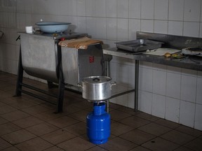 A gas stove used for cooking in a restaurant during a period of loadshedding in the township of Namahadi, Frankfort, South Africa, on Saturday, June 3, 2023. The rural town of Frankfort has returned into scheduled blackouts, following a court-issued ban sought by Eskom Holdings SOC Ltd. against Rural Free State (Pty) Ltd., who were easing loadshedding schedules for residents by providing power from a local photovoltaic solar plant. Photographer: Michele Spatari/Bloomberg