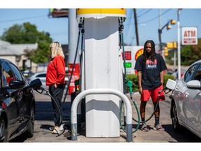 People pump gas in Austin, Texas.