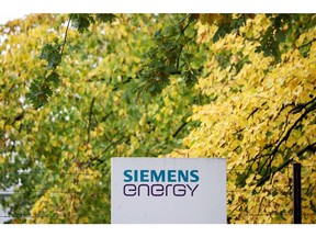 A Siemens Energy AG logo on a sign at one of the company's buildings in Siemensstadt district in Berlin, Germany, on Friday, Oct. 27, 2023. Siemens Energy AG is in talks with the German government about securing as much as 16 billion ($16.9 billion) in state guarantees as problems at its wind-turbine unit spread to the rest of the business. Photographer: Liesa Johannssen-Koppitz/Bloomberg