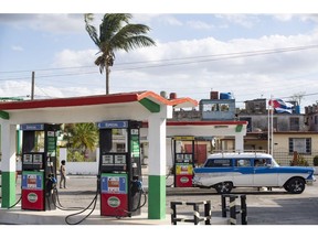 A vehicle fuels up at a gas station in Matanzas, Cuba, on March 29. Photographer: Yander Zamora/Bloomberg