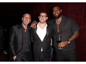 Alex Pirez, Jeff Zalaznick and LeBron James at Carbone Beach on May 4 in Miami Beach.  Photographer: Alexander Tamargo/Getty Images North America
