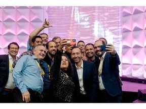 Jonathan Buckle, SVP Americas at Mitel, takes a celebratory selfie with attendees during the 2024 Mitel Next Awards in San Antonio, Texas.