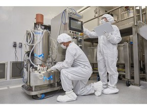 MilliporeSigma operators monitoring viral vector production in a bioreactor in MilliporeSigma's Carlsbad, California manufacturing facility