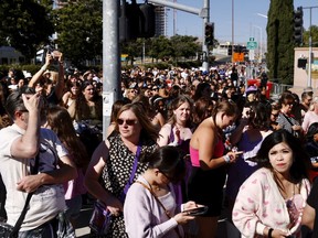 FILE - Fans wait to go through security before Taylor Swift performs at Levi's Stadium in Santa Clara, Calif. on July 28, 2023. The 2022 fiasco after there were a myriad of problems with fans trying to buy tickets for Swift's massive "Eras" tour shone a light on cracks in the ticketing system.