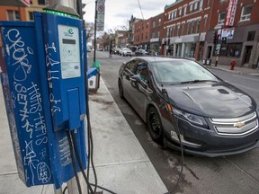 An EV charging station powering up a Chevrolet Volt in Quebec.