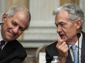 U.S. chairperson of the Federal Deposit Insurance Corporation (FDIC) Martin Gruenberg, left, shares a word with Federal Reserve chair Jerome Powell before an open session of the Financial Stability Oversight Council.