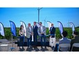 Nina Yoo (Fengate), George Theodoropoulos (Fengate), Greg Calhoun (Fengate), Andrew Cogan (Fengate) and Jim Spencer (Exus) cut the ribbon for the Prairie Switch Wind project.
