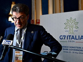 Italy's Finance minister Giancarlo Giorgetti speaks to reporters at the G7 meeting in Stresa, northern Italy.