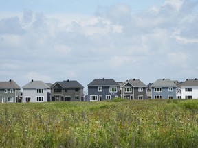A study by Canada's national housing agency says housing starts aren't keeping pace with residential construction resources available due to restrictive regulations and a "highly fragmented" industry. A row of new homes is pictured in Ottawa on Monday, Aug. 14, 2023.
