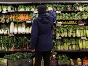 A customer shops for produce at a grocery store In Toronto.