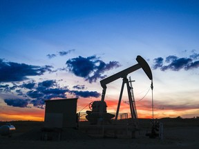 A pumpjack draws out oil from a well head near Calgary.