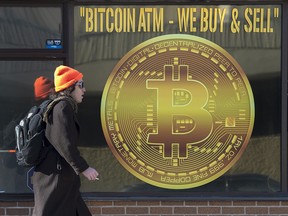 A sign advertising a Bitcoin ATM at a shop in Halifax, N.S.