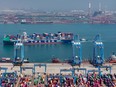 A cargo ship loaded with containers at a port in Qingdao, in eastern China's Shandong province.