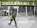 A person walks past a Dollarama Inc. store in Montreal.