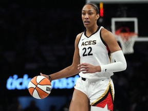 FILE - Las Vegas Aces' A'ja Wilson (22) looks to pass during the first half in Game 3 of a WNBA basketball final playoff series against the New York Liberty Sunday, Oct. 15, 2023, in New York. The Two-time WNBA MVP is getting a Nike signature shoe, in a deal that was announced Saturday, May 11, 2024.