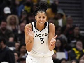 FILE - Las Vegas Aces forward Candace Parker reacts during the first half of a WNBA basketball game against the Seattle Storm, May 20, 2023, in Seattle. The three-time WNBA champion has announced she's retiring. Parker, a two-time league MVP, announced in a social media post on Sunday, April 28, 2024 that she's ending her career after 16 seasons.