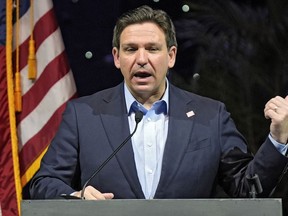 FILE - Florida Gov. Ron DeSantis speaks at the Governor's Day luncheon, Feb. 8, 2024, in Tampa, Fla. Climate change will be a lesser priority in Florida and largely disappear from state statutes under legislation signed Wednesday, May 15 by Gov. DeSantis, which also bans power-generating wind turbines offshore or near the state's lengthy coastlines.