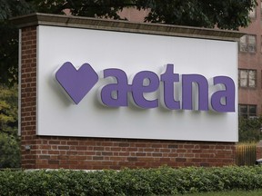 FILE - A sign sits on the campus of the insurance and managed health care company Aetna, Aug. 28, 2020, in Hartford, Conn. Aetna has agreed to settle a lawsuit that accused the health insurer of discriminating against LGBTQ+ patients.