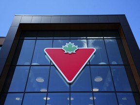 A Canadian Tire logo is displayed on a store in Ottawa on Friday, Aug. 11, 2023. Canadian Tire Corp. Ltd. reported its first-quarter profit rose compared with a year ago as its revenue fell about five per cent.