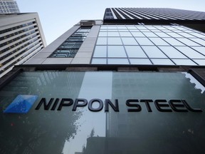 FILE - Nippon Steel Corporation's logo is displayed on a sign outside its headquarters in Tokyo on Nov. 26, 2021. Nippon Steel said Friday, May 3, 2024, it has postponed the expected closing of its $14.1 billion takeover of U.S. Steel by three months after the U.S. Department of Justice requested more documentation related to the deal.