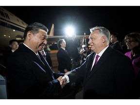 Viktor Orban greets Xi Jinping at Liszt Ferenc Budapest airport in Ferihegy, Hungary on May 8. Photographer: Vivien Cher Benko/AFP/Getty Images