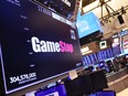 The Gamestop company logo is displayed on a screen as traders work on the floor of the New York Stock Exchange during morning trading on March 22, 2023 in New York City.
