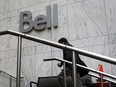 A pedestrian arrives at BCE Inc.'s Bell Canada office building in Toronto on Aug. 8, 2012.