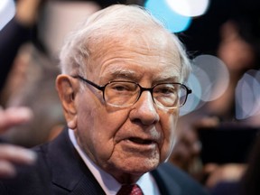 In this file photo taken on May 04, 2019, Warren Buffett, CEO of Berkshire Hathaway, speaks to the press as he arrives at the 2019 annual shareholders meeting in Omaha, Neb.