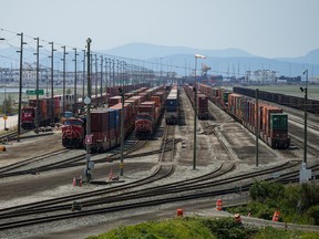 CP and CN rail trains are seen as cargo containers sit idle on rail tracks at Deltaport during a strike by International Longshore and Warehouse Union Canada workers in the province, in Delta, B.C., on July 7, 2023.