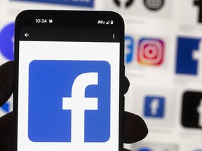 The Facebook logo is seen on a mobile phone on Oct. 14, 2022.