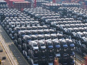 BYD electric cars waiting to be loaded onto ships are seen stacked at the Taicang Port international container terminal in Suzhou, east China's Jiangsu province on February 8, 2024.