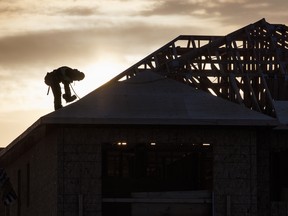 A worker at a home under construction in Vaughan, Ont. on Dec. 20. 2022.