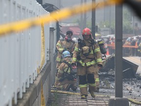 Firefighters work to extinguish a fire at a lithium battery factory in Hwaseong on June 24, 2024.
