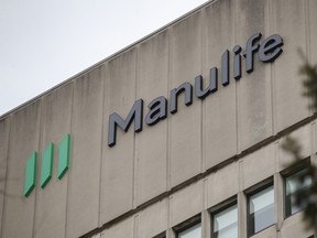 Signage is seen on Manulife Financial Corp.'s office tower in Toronto on Feb. 11, 2020.