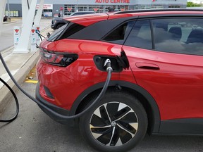 A 2022 Volkswagen ID.4 EV is shown at a charging station at a Scarborough, Ont. Canadian Tire on June 14, 2023.