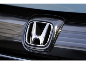 A Honda Motor Co. badge is displayed on the front grille of a Freed Hybrid minivan at one of the company's showrooms in Tokyo, Japan, on Wednesday, Feb. 1, 2017. Honda is scheduled to report third-quarter earnings figures on Feb. 3. Photographer: Kiyoshi Ota/Bloomberg