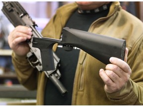 A bump stock device that fits on a semi-automatic rifle. Photographer: George Frey/Getty Images