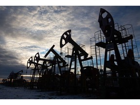 Oil pumping jacks, also known as "nodding donkeys", in an oilfield near Neftekamsk, in the Republic of Bashkortostan, Russia, on Thursday, Nov. 19, 2020. The flaring coronavirus outbreak will be a key issue for OPEC+ when it meets at the end of the month to decide on whether to delay a planned easing of cuts early next year. Photographer: Andrey Rudakov/Bloomberg