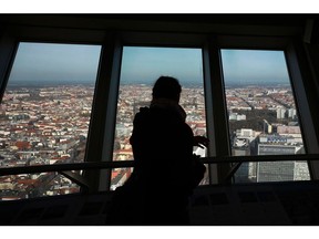 A visitor looks out over the city skyline from the Berlin TV Tower in Berlin, Germany on Thursday, Feb. 9, 2023. Chancellor Olaf Scholz's Social Democrats crashed to their worst-ever result in Berlin, failing to win an election in the German capital for the first time since 1999 as the conservative Christian Democrats surged to victory. Photographer: Krisztian Bocsi/Bloomberg