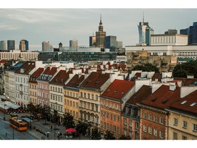 Skyscraper office buildings on the city skyline beyond residential and commercial buildings in the old town area of Warsaw, Poland, on Wednesday, Aug. 2, 2023. Polish housing prices are expected to rebound after the government began offering subsidized mortgages to counter surging financing costs. Photographer: Damian Lema?ski/Bloomberg