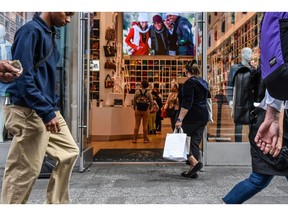 Shoppers in the Times Square neighborhood of New York, US, on Friday, Oct. 27, 2023. The US economy grew at the fastest pace in nearly two years last quarter on a burst of consumer spending, which will be tested in coming months.