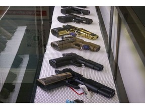 Handguns for sale at a store in Hollywood, Florida, US, on Monday, Oct. 23, 2023. Anxiety about antisemitism is causing some people to rethink their reluctance to own a firearm -- and the Sunshine State's laws make it easier to obtain one. Photographer: Eva Marie Uzcategui/Bloomberg