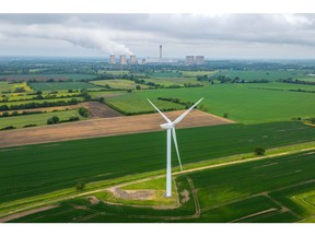 A wind turbine in a field near the Drax Power Station, operated by Drax Group Plc, near Selby, UK, on Tuesday, May 21, 2024. Photographer: Dominic Lipinski/Bloomberg